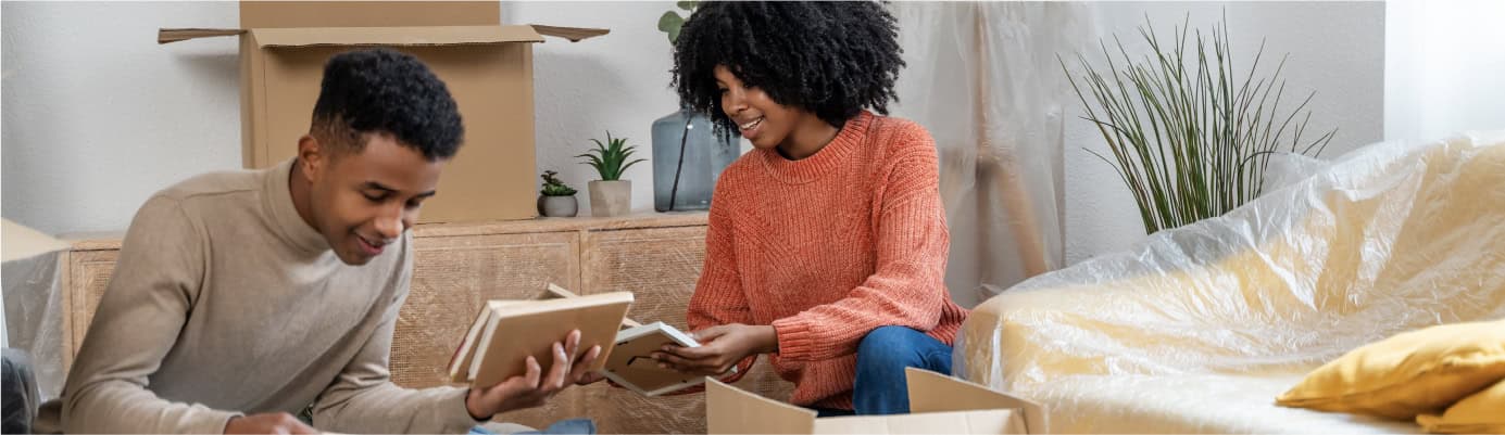 A young couple unpacking - Moving during holidays - United Van Lines